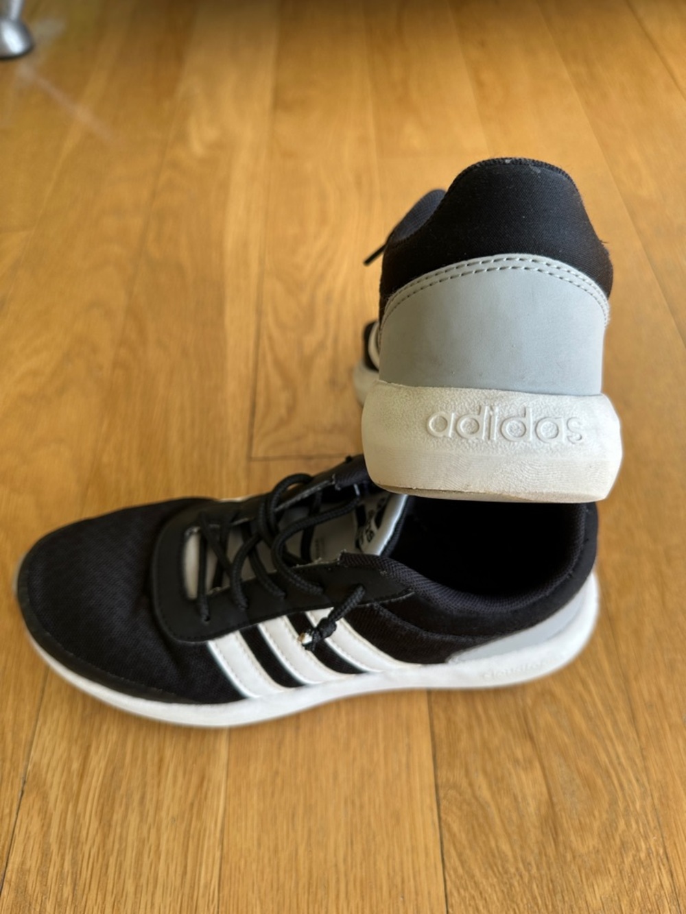 adidas Women’s Black Sneakers with White Stripes